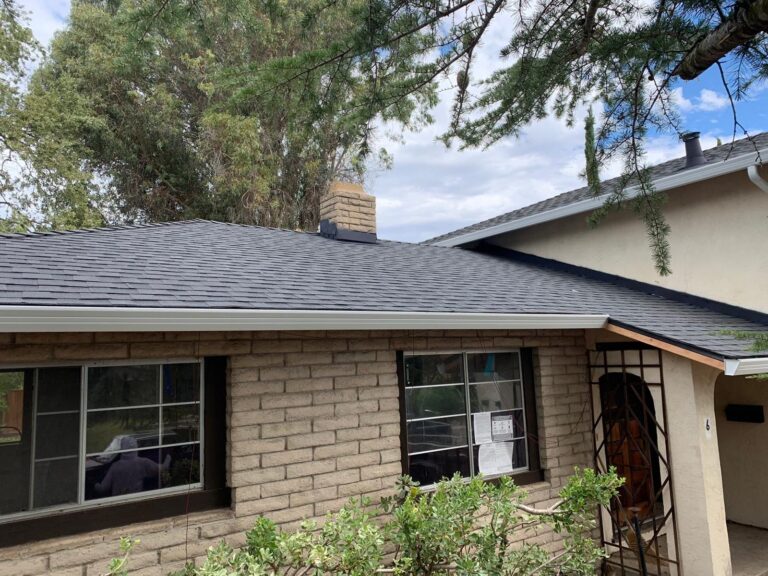 questions to ask a roofer. picture of side of house and new roof.